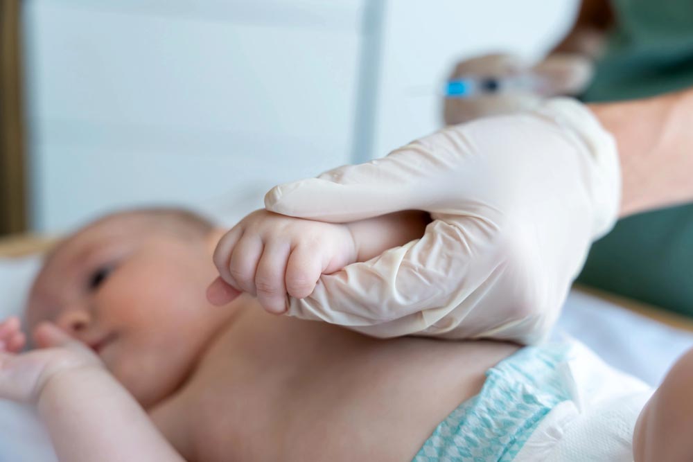 Pediatrician examining little baby to prevent diseases. Healthcare, baby, vaccination concept
